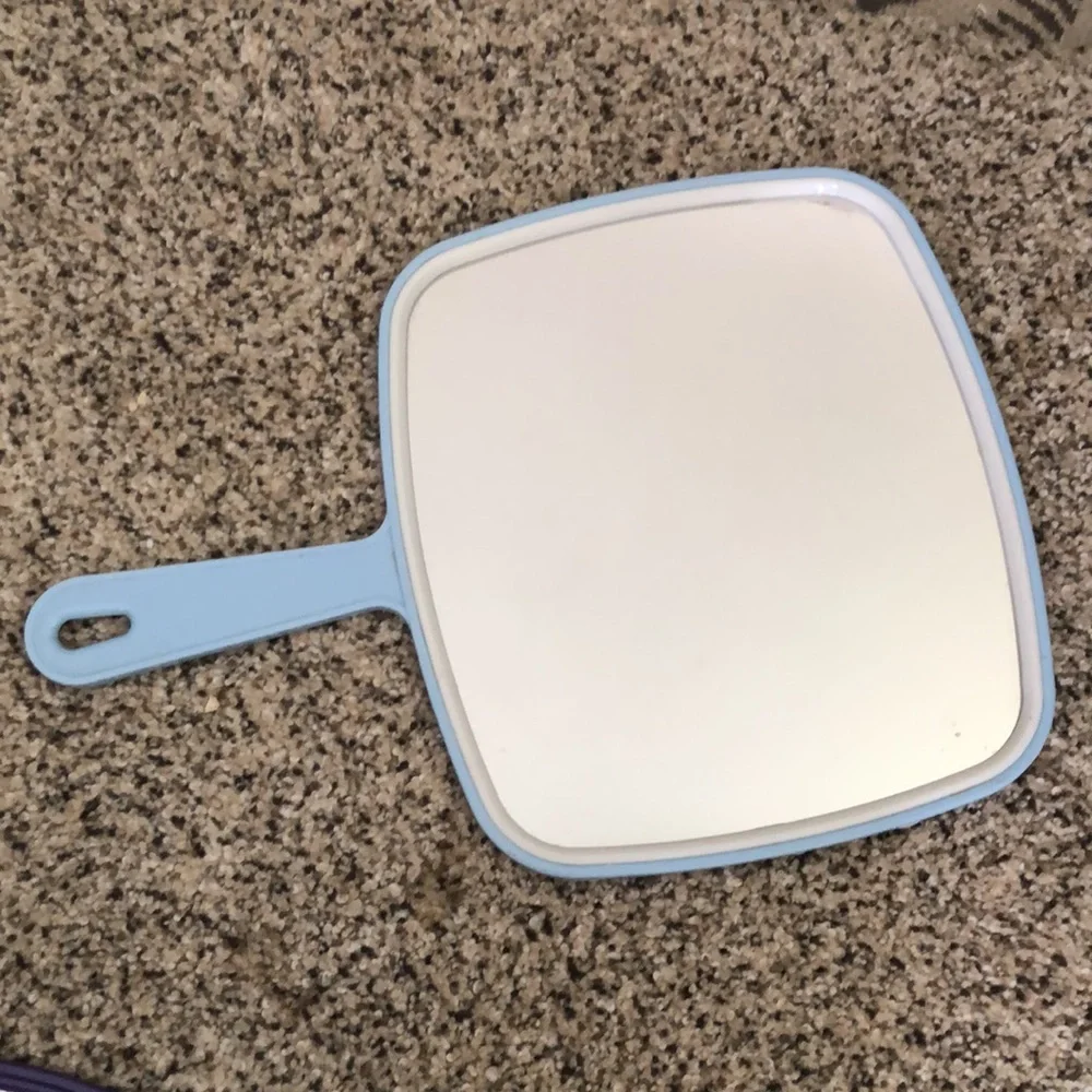 Three hand held mirrors. Good condition. The blue and the green one are vintage
